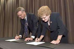 Black & Veatch and KU officials sign an agreement establishing a Project Management Program for B&V employees.