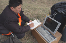 Graduate student Seong Hoon Kim collects data at a construction site