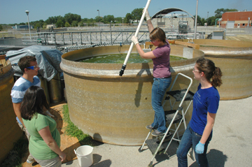 Belinda Sturm and her research team work on a project at the Lawrence Wastewater Treatment Plant in Lawrence, Kan.