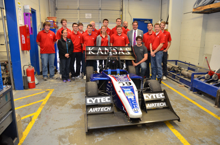 After a long chat, Reuss stops for a group picture with members of the Jayhawk Motorsports