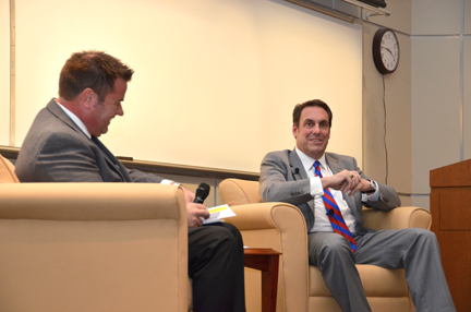 Associate Prof. Robb Sorem leads a fireside chat with Mark Reuss, President of GM North America.