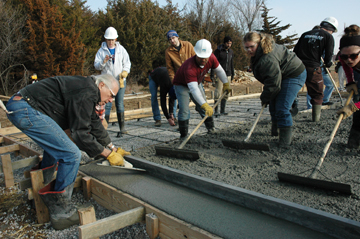KU students pouring a concrete slab