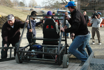 Students unloading go-kart