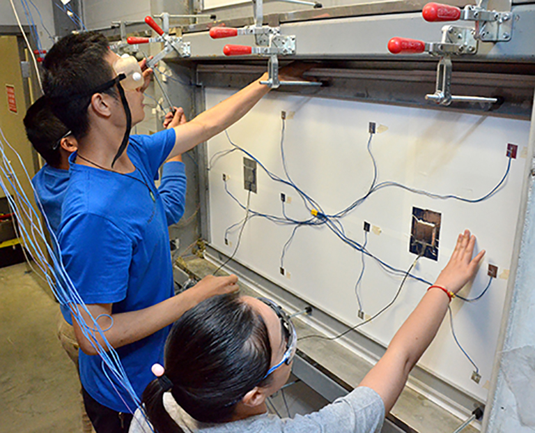 Students performing an experiment