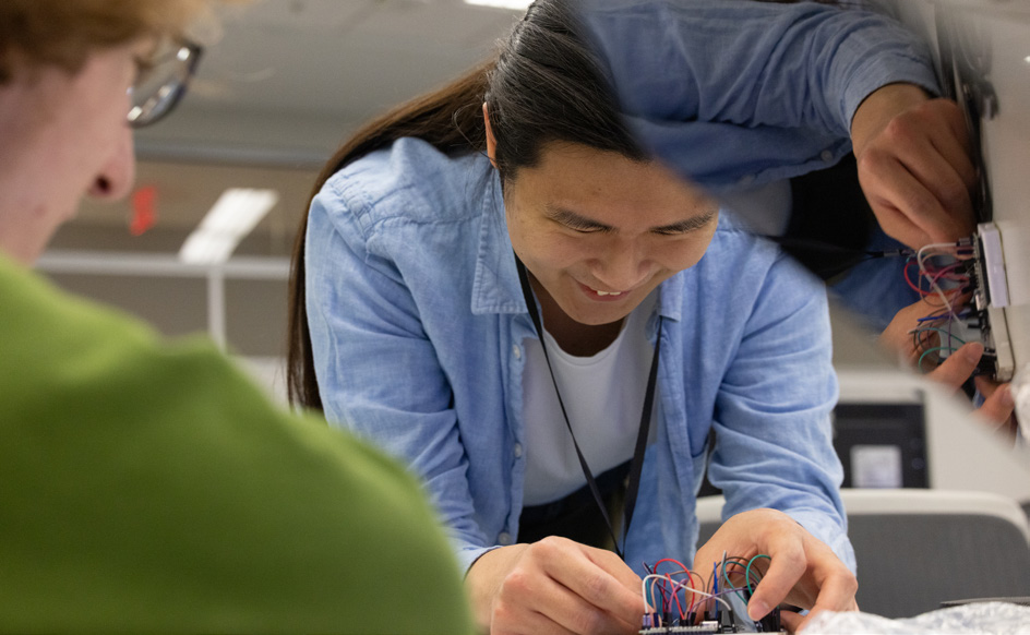Computer engineering students working on a project