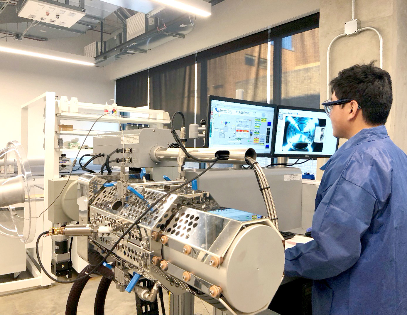 A student sitting at a computer in the lab