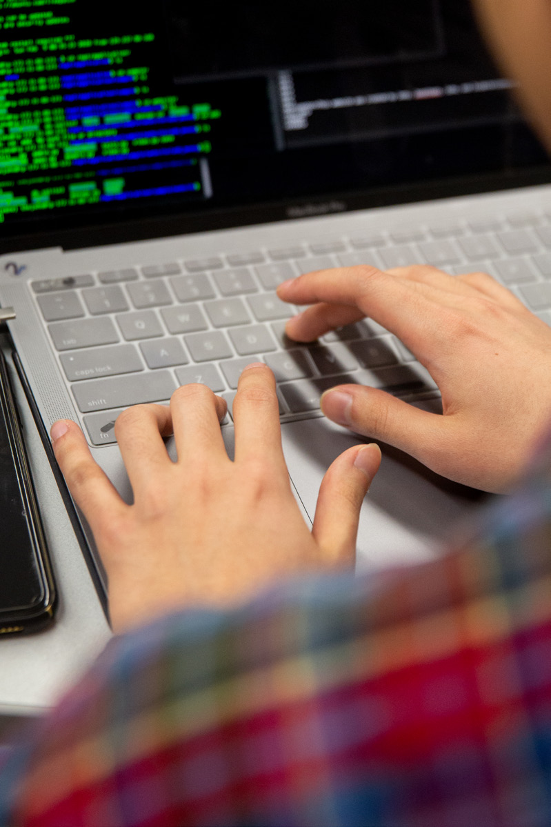 Fingers typing on a keyboard