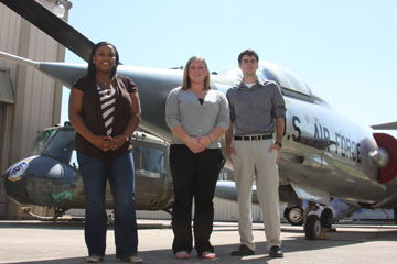 Lauren Fitzpatrick, Sarah Kulhanek, and Chris Vaughn in front of an Air Force jet