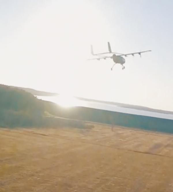 A plane flying over a field